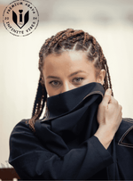 Woman with braided hair wearing premium designer abaya, close-up, luxury modest fashion