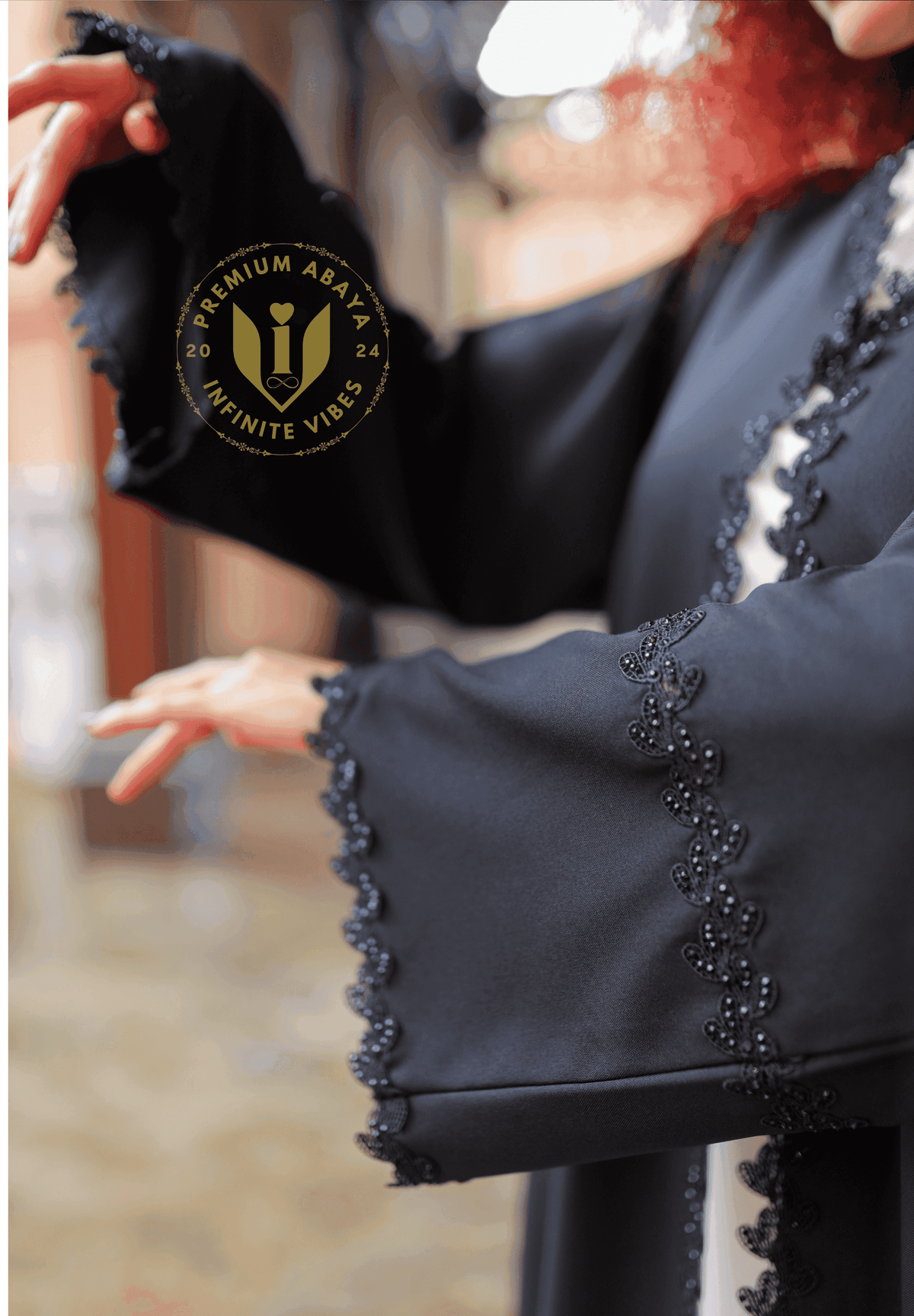 Black designer abaya with intricate beaded trim and flared sleeves, outdoor setting