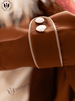 Brown abaya sleeve with white trim and decorative buttons, close-up view