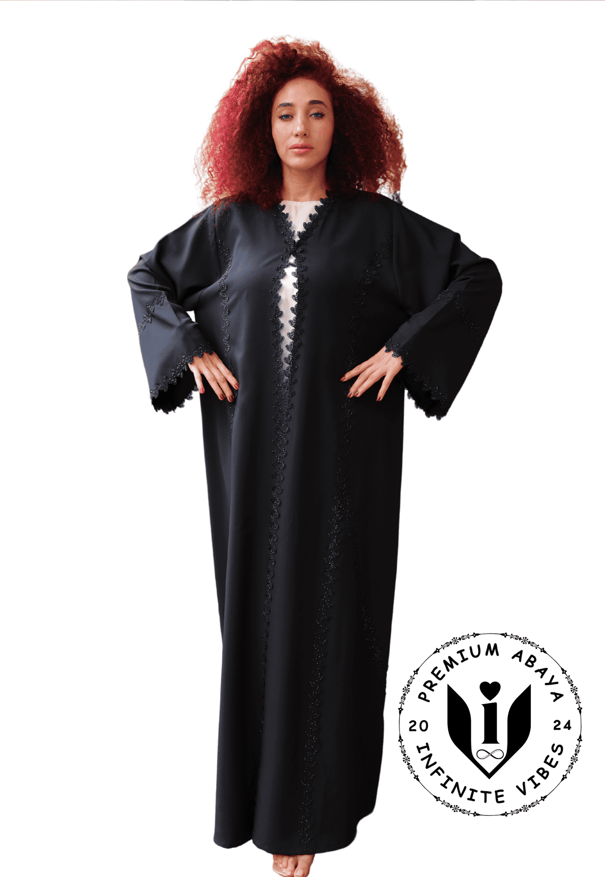 Woman wearing a black designer abaya with scalloped trim, premium modest fashion UAE