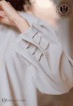 Close-up of dusty beige abaya sleeve with stitched details, modest fashion UAE
