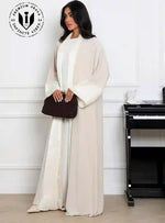 Stylish_Muslim_woman_wearing_luxury_abaya_with_clutch_and_heels_for_evening_wear