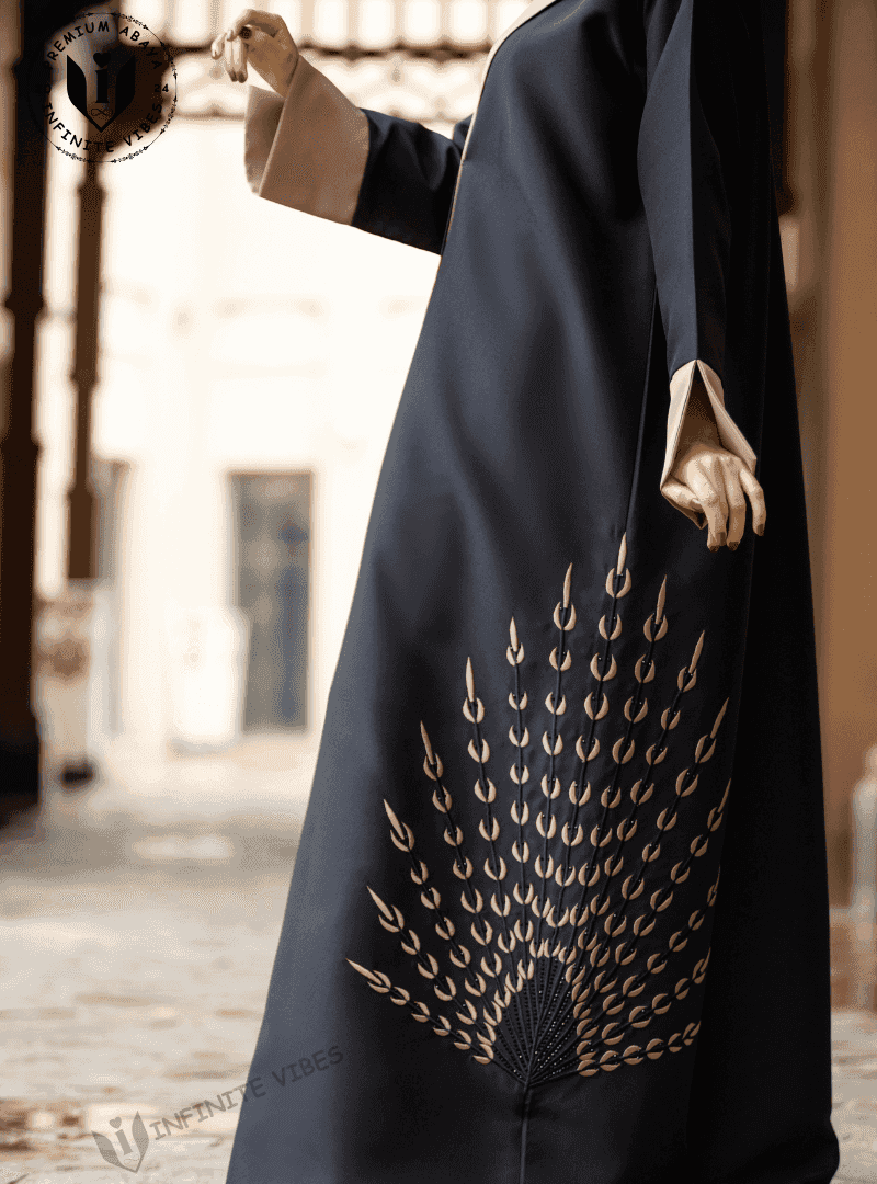Black abaya with gold peacock feather-inspired embroidery, modest fashion UAE