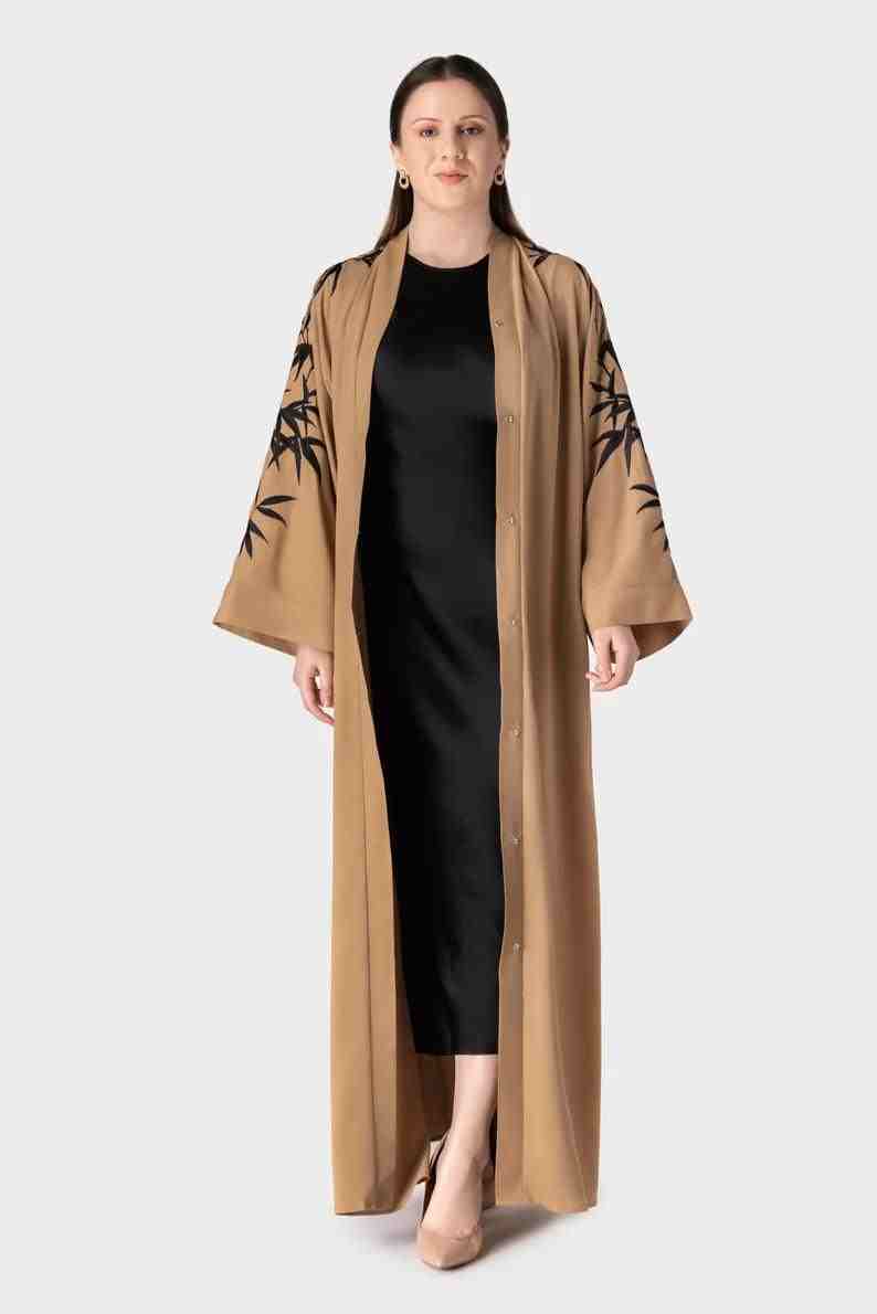 Dubai abaya with bamboo embroidery, beige abaya with belt and button details for stylish modest wear