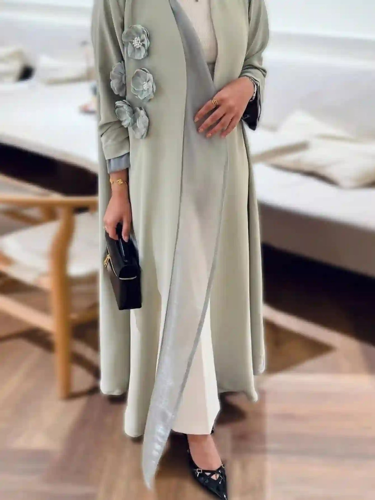 Elegant light grey abaya with floral appliqué, modest fashion for women in Dubai, UAE.