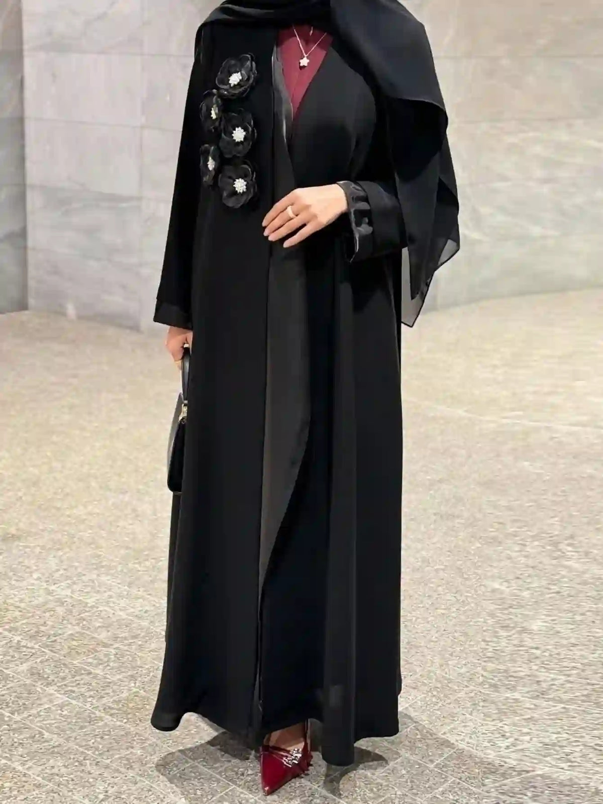 Elegant black abaya with floral embellishments, modest fashion, Dubai UAE style
