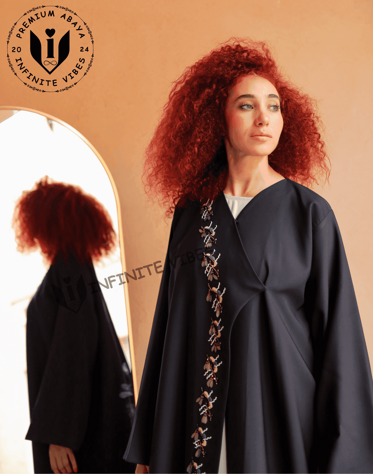 Woman wearing black embroidered abaya with floral beadwork, modern modest fashion