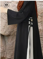 Premium black abaya with white contrast panel and lace-up detail, modest Dubai fashion