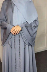 Elegant light grey abaya with bead embellishments, modest full-length design, UAE fashion