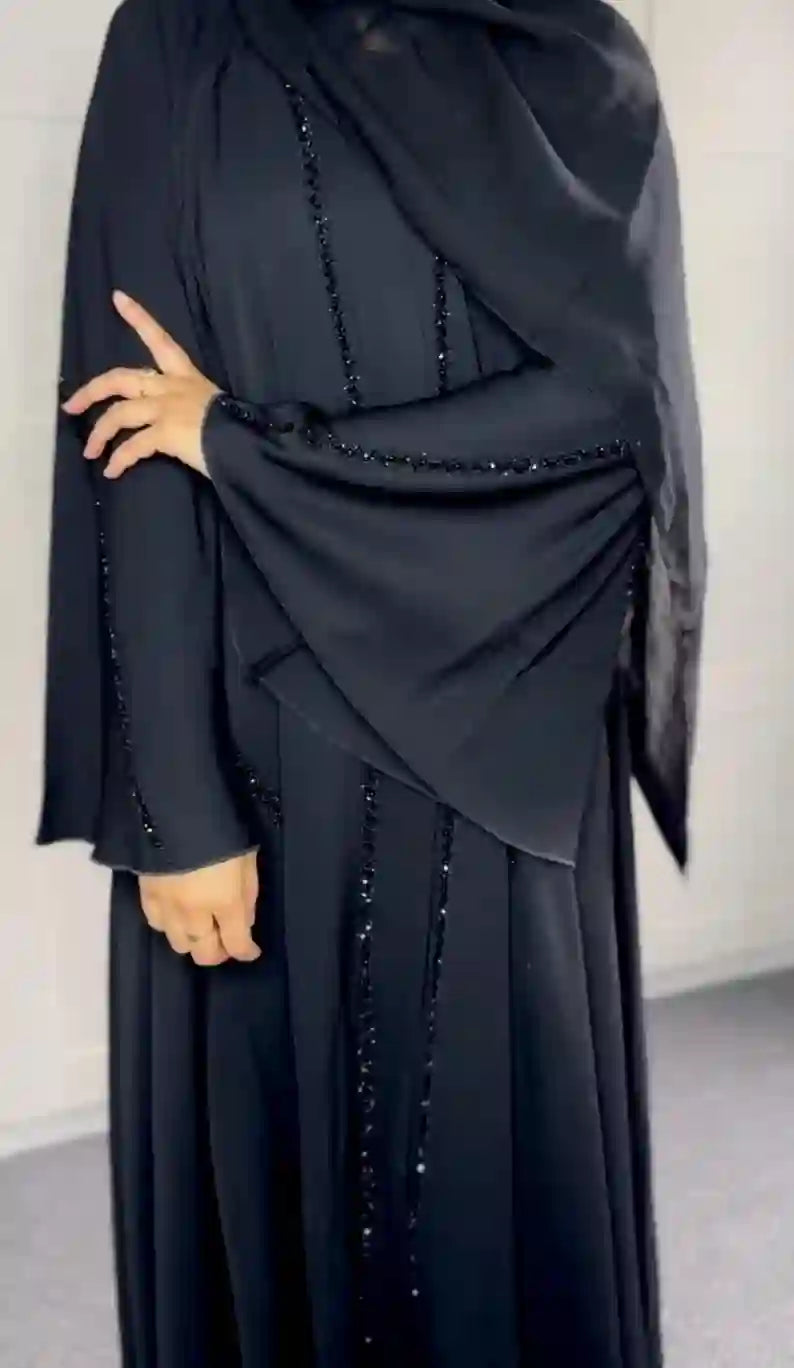 Black umbrella abaya with beaded detailing, modest fashion for women, 2025 design