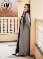 Woman in grey designer abaya with long braids on balcony, modest fashion, UAE abayas