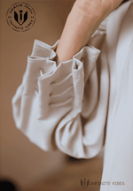 Elegant beige abaya sleeve with pleated ruffle detail, premium modest fashion style