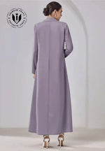 Elegant beige abaya with tailored design, long sleeves, and modest full length, viewed from back.