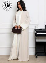 Stylish_Muslim_woman_wearing_luxury_abaya_with_clutch_and_heels_for_evening_wear