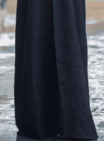 Black abaya with delicate floral handwork embroidery on flowing fabric