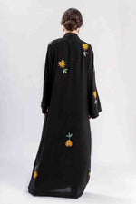 Modest fashion black abaya with intricate gold embroidery